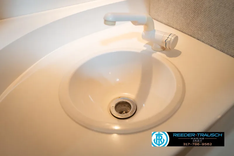 Slide: The Image of White sink with faucet in a Nordic Heat 28, 2001 model boat. - 43