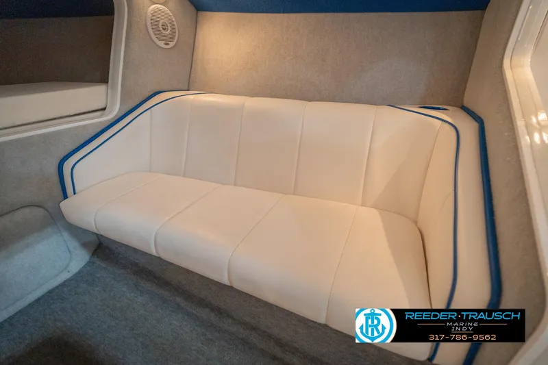 Slide: The Image of Interior of a 2001 Nordic Heat 28 boat with white and blue seating. - 46