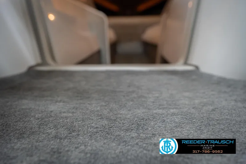 Slide: The Image of Interior view of a 2001 Nordic Heat 28 boat with carpeted flooring. - 48