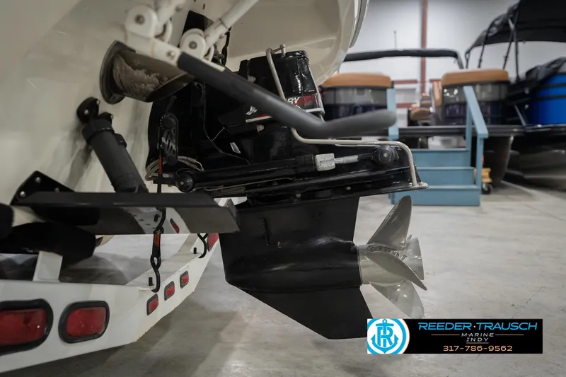 Slide: The Image of Rear view of a 2001 Nordic Heat 28 boat with visible propeller and outboard motor. - 49