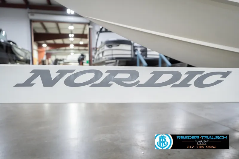 Slide: The Image of Nordic Heat 28 boat, 2001 model, displayed indoors at Reeder Trausch Marine. - 57