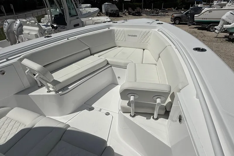 Slide: The Image of 2026 Everglades 335 Center Console boat with spacious white seating area. - 12