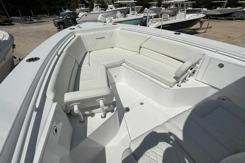 Slide: The Image of 2026 Everglades 335 Center Console boat with spacious white seating area. - 13