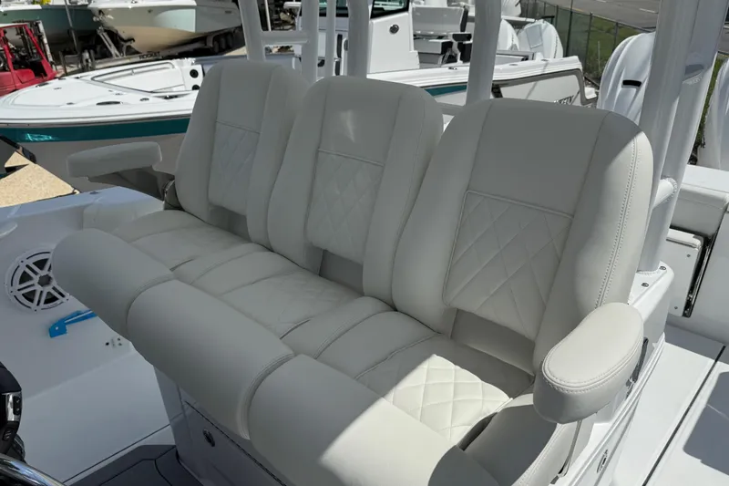 Slide: The Image of Luxurious seating on 2026 Everglades 335 Center Console boat, featuring plush white upholstery. - 27