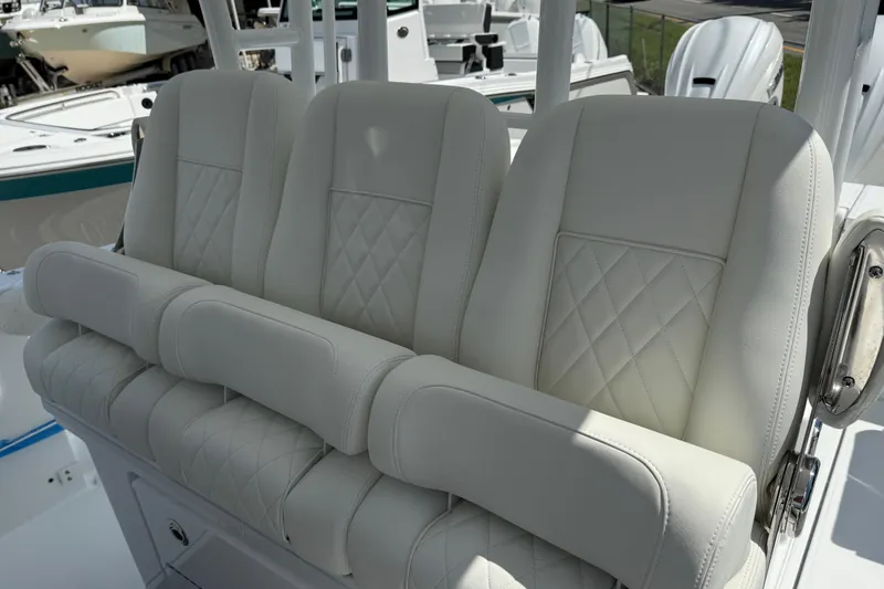 Slide: The Image of Luxurious seating on 2026 Everglades 335 Center Console boat, featuring elegant white upholstery. - 28
