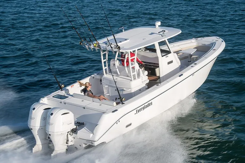 Slide: The Image of Manufacturer Provided Image: 2025 Everglades 335 Center Console boat cruising on open water. - 3