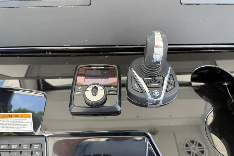 Slide: The Image of Control panel of 2026 Everglades 335 Center Console boat with joystick and display. - 31
