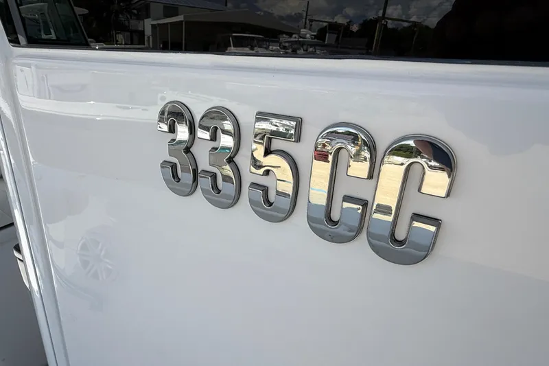Slide: The Image of Chrome "335CC" emblem on 2026 Everglades 335 Center Console boat. - 34