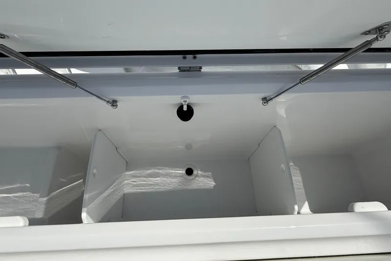 Slide: The Image of Open storage compartment of 2026 Everglades 335 Center Console boat. - 40