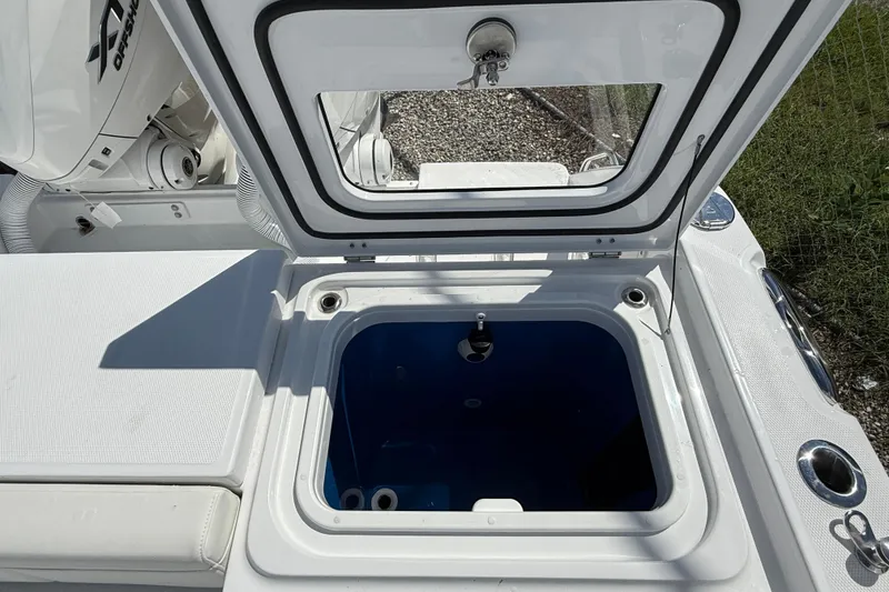 Slide: The Image of Open storage compartment on 2026 Everglades 335 Center Console boat, showcasing interior features. - 44