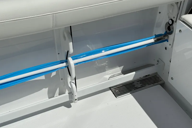 Slide: The Image of Interior view of 2026 Everglades 335 Center Console boat, featuring storage and seating area. - 45