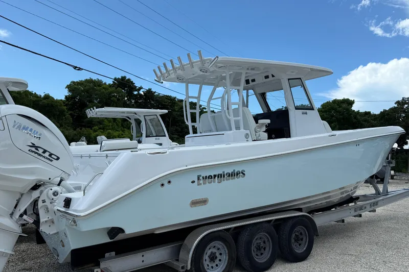 Slide: The Image of 2026 Everglades 335 Center Console boat on trailer, featuring Yamaha XTO Offshore engine. - 5