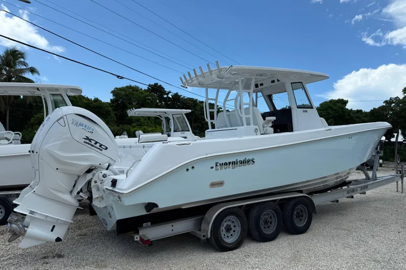 Slide: The Image of 2026 Everglades 335 Center Console boat on trailer, featuring Yamaha outboard engine. - 6