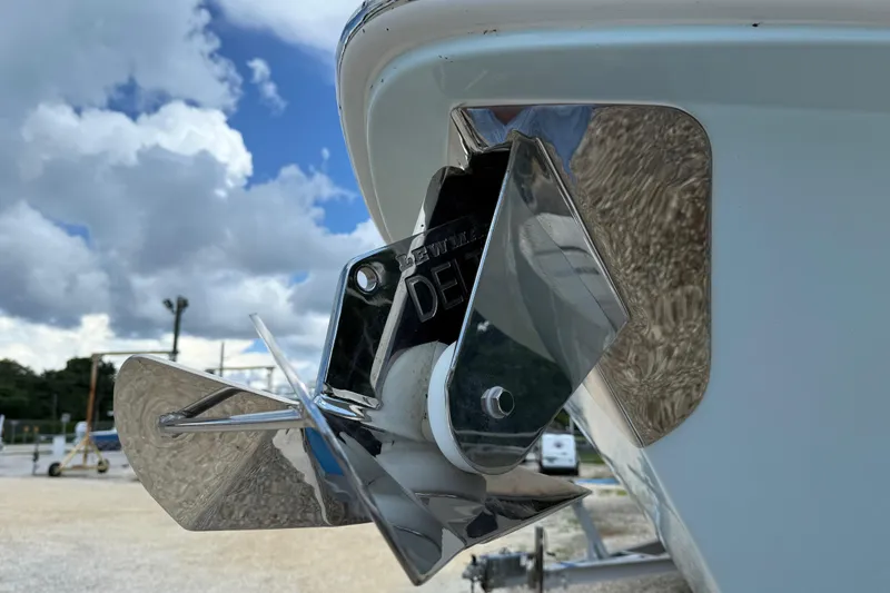 Slide: The Image of Close-up of 2026 Everglades 335 Center Console boat anchor against cloudy sky. - 9