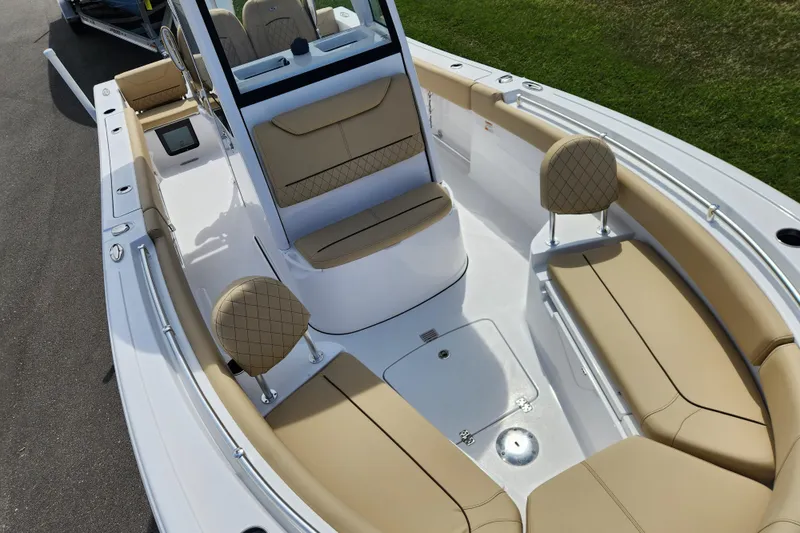 Slide: The Image of 2026 Sportsman Heritage 231 Center Console boat with tan seating and sleek design. - 10