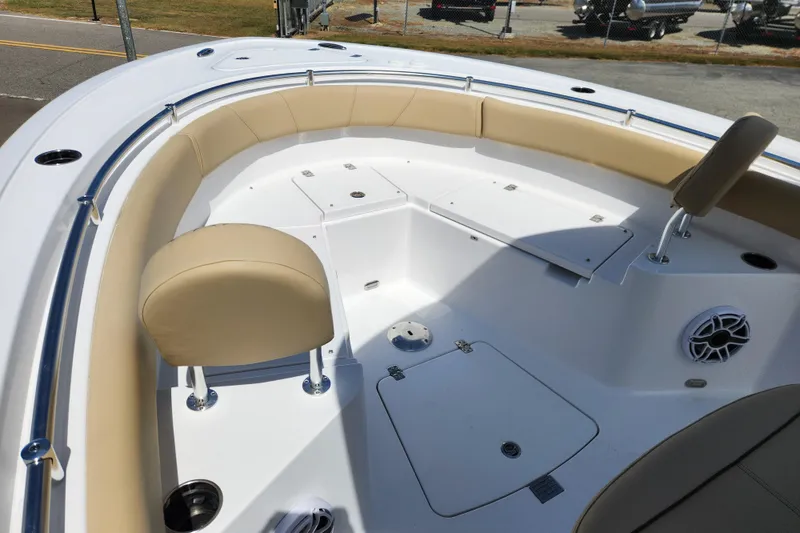 Slide: The Image of 2026 Sportsman Heritage 231 Center Console boat with beige seating and spacious deck. - 7