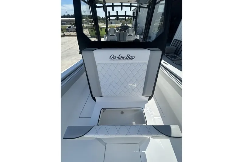 Slide: The Image of 2022 Onslow Bay 33 Tournament boat interior with seating and storage. - 16