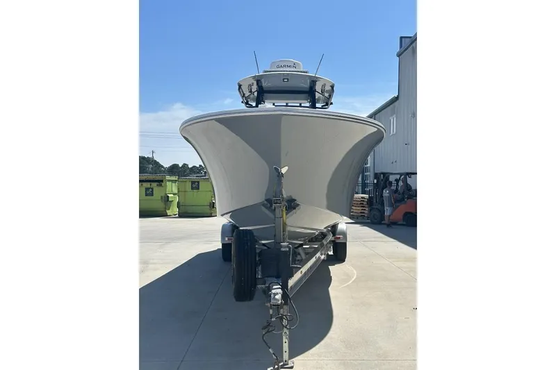 Slide: The Image of 2022 Onslow Bay 33 Tournament boat on trailer, parked outdoors. - 2