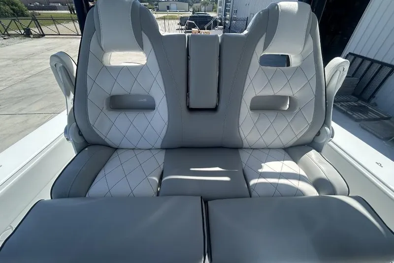 Slide: The Image of Luxurious seating on 2022 Onslow Bay 33 Tournament boat, featuring diamond-stitched upholstery. - 5