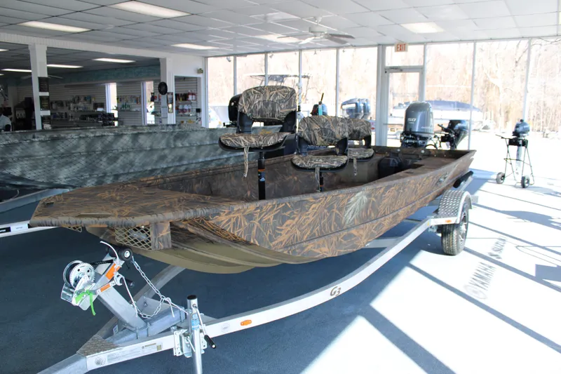 The Image of 2025 G3 Gator Tough 16 DK boat with camouflage design in showroom. - 0