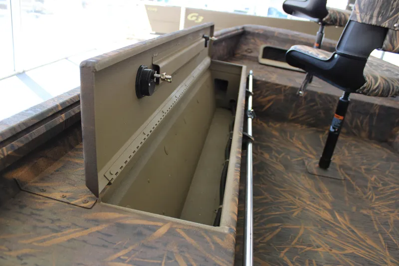 Slide: The Image of 2025 G3 Gator Tough 16 DK boat interior with storage compartment and seating. - 10