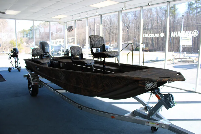 Slide: The Image of 2025 G3 Gator Tough 16 DK boat on display in showroom. - 7