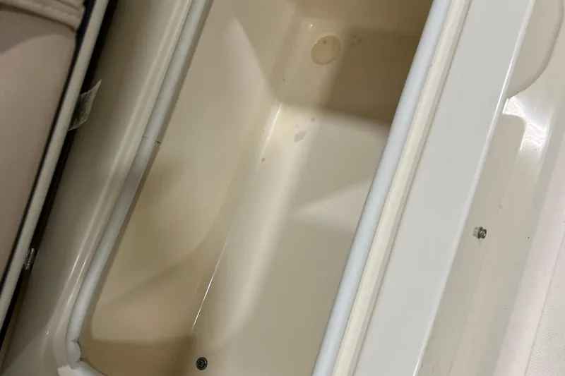 Slide: The Image of Storage compartment of 2025 Scout 175 Sport Dorado boat, featuring a clean, spacious interior. - 10