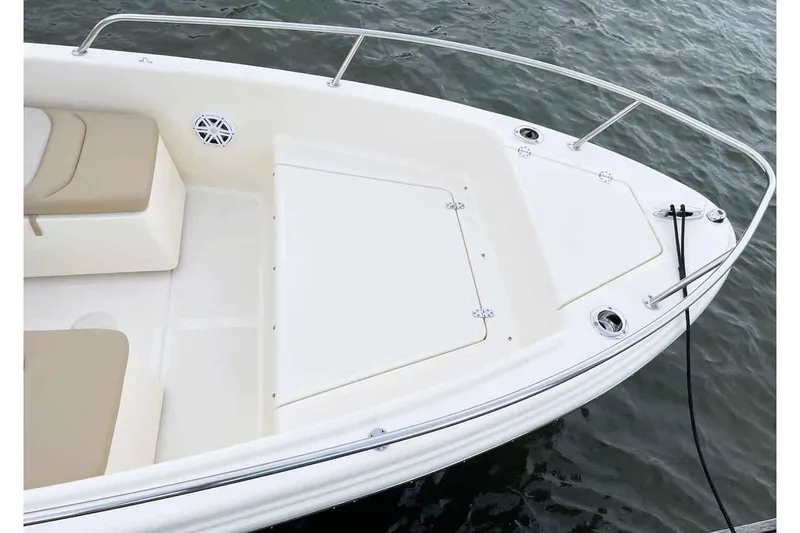 Slide: The Image of Manufacturer Provided Image: 2025 Scout 175 Sport Dorado boat, white deck, beige seating, on water. - 21