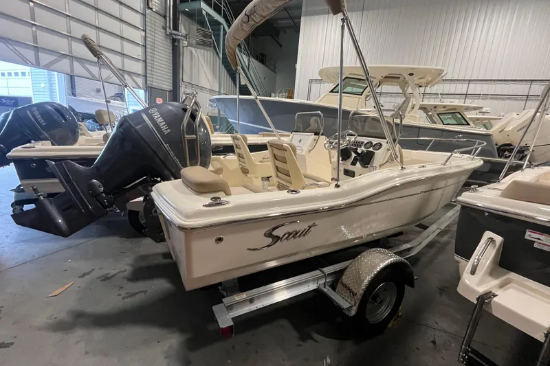 Slide: The Image of 2025 Scout 175 Sport Dorado boat in showroom, featuring Yamaha outboard motor. - 4