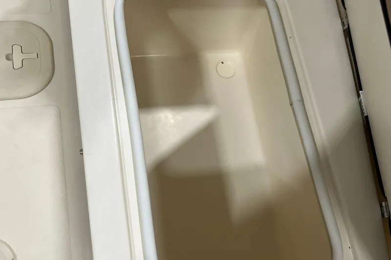 Slide: The Image of Storage compartment of 2025 Scout 175 Sport Dorado boat, featuring a clean, spacious interior. - 9