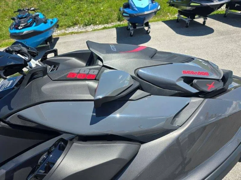 Slide: The Image of 2026 Sea-Doo GTR-X 300 jet ski in gray on parking lot. - 17