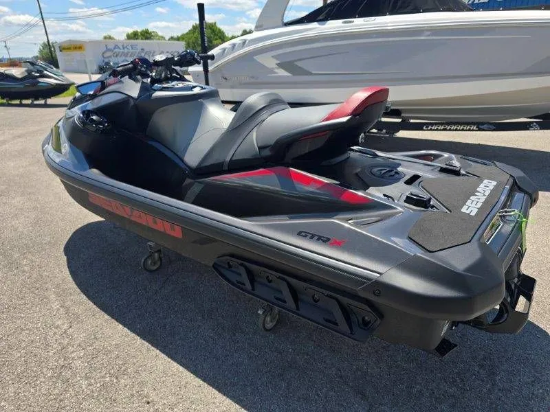 Slide: The Image of 2026 Sea-Doo GTR-X 300 jet ski parked outdoors. - 21