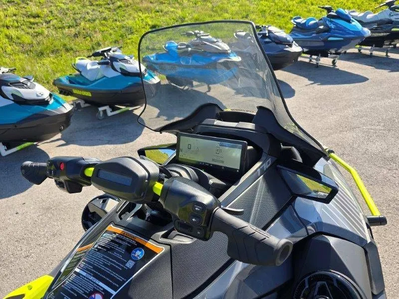 Slide: The Image of 2026 Sea-Doo Explorer Pro 170 with windshield and display, parked outdoors. - 20
