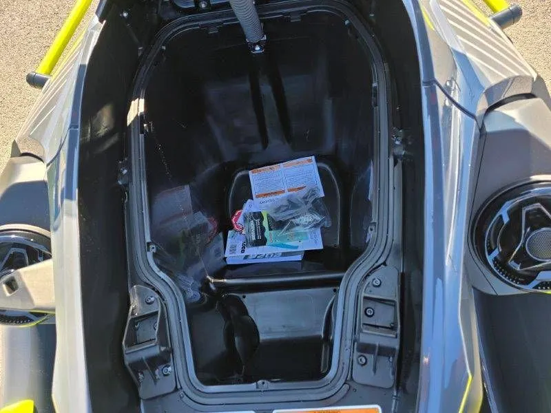 Slide: The Image of Interior of 2026 Sea-Doo Explorer Pro 170 with manual and accessories. - 21