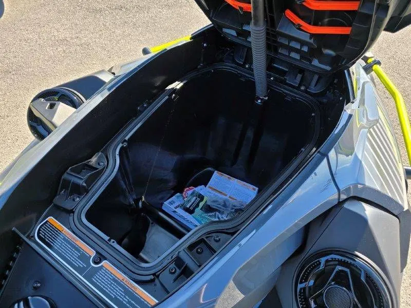 Slide: The Image of Sea-Doo Explorer Pro 170 2026 storage compartment with open lid. - 22