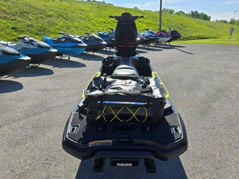 Slide: The Image of 2026 Sea-Doo Explorer Pro 170 on lot with other jet skis. - 29
