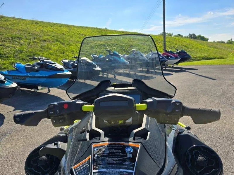 Slide: The Image of 2026 Sea-Doo Explorer Pro 170 with windshield, parked on a lot. - 30