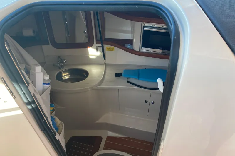 Slide: The Image of 2024 Grady-White Freedom 375 boat interior with sink and storage. - 11