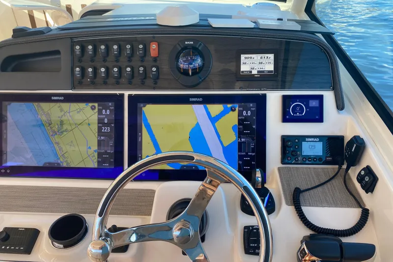 Slide: The Image of 2024 Grady-White Freedom 375 helm with advanced navigation displays and controls. - 17