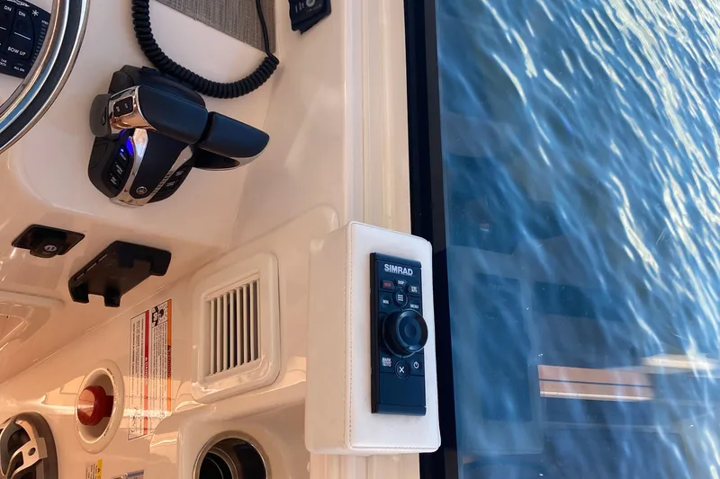 Slide: The Image of Control panel of 2024 Grady-White Freedom 375 boat with Simrad system. - 19