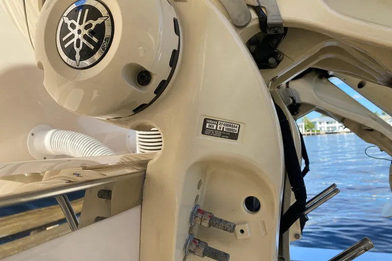 Slide: The Image of 2024 Grady-White Freedom 375 boat with Yamaha engine detail by the water. - 28