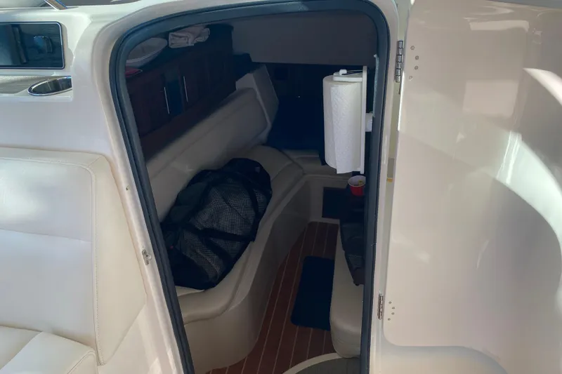 Slide: The Image of 2024 Grady-White Freedom 375 cabin interior with seating and storage. - 9