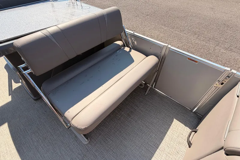 Slide: The Image of 2022 Avalon 2585 ENT Catalina Platinum boat interior with gray seating and flooring. - 10