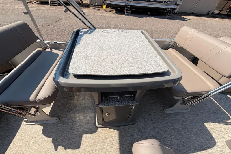 Slide: The Image of 2022 Avalon 2585 ENT Catalina Platinum boat interior with seating and table. - 15