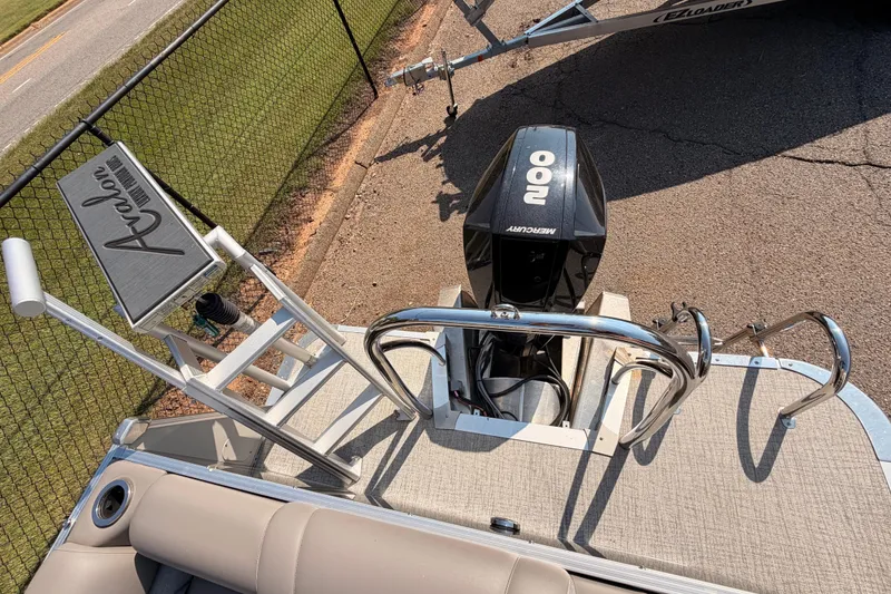 Slide: The Image of 2022 Avalon 2585 ENT Catalina Platinum boat with Mercury engine, docked on trailer. - 16