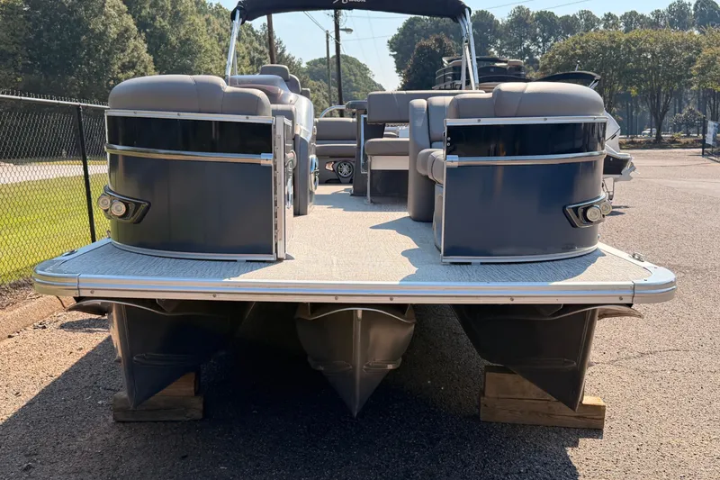 Slide: The Image of 2022 Avalon 2585 ENT Catalina Platinum pontoon boat on display outdoors. - 2