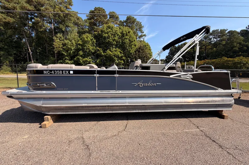 Slide: The Image of 2022 Avalon 2585 ENT Catalina Platinum pontoon boat on display outdoors. - 4