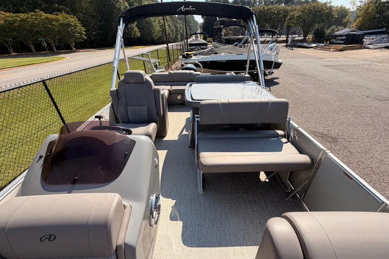 Slide: The Image of 2022 Avalon 2585 ENT Catalina Platinum pontoon boat interior with seating and table. - 9