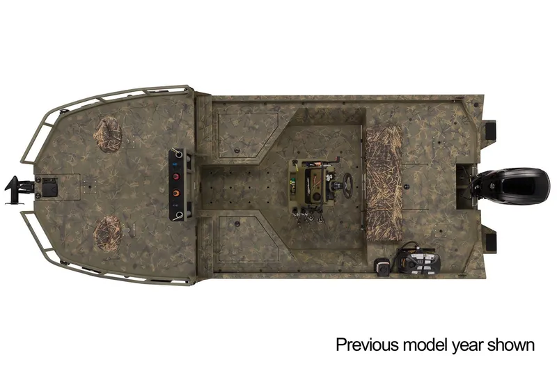 Slide: The Image of 2023 Tracker Grizzly 2072 CC Sportsman boat with camouflage deck in a parking lot. - 3