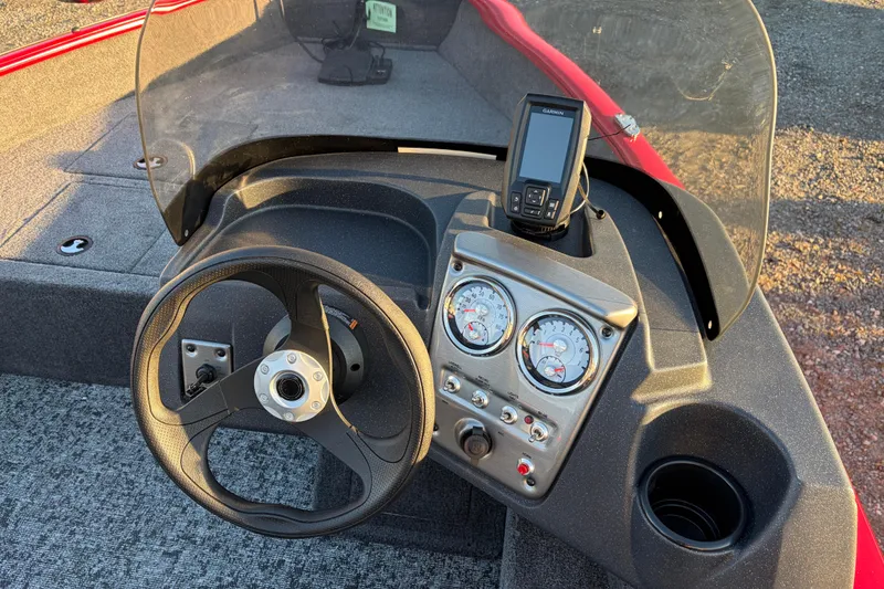 Slide: The Image of Steering console of 2026 Tracker Pro Guide V-16 SC boat with gauges and GPS device. - 83
